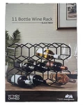 Evergreen Black Wine Rack Holds Up 11 Space-saving Storage. Fixed Price $34.95.