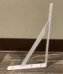 Style Selections 11.69 In Shelf Bracket Model # 25223PHLLG. Fixed Price $5.00.